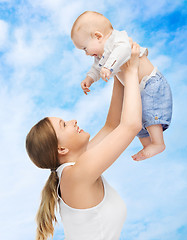 Image showing happy mother with adorable baby