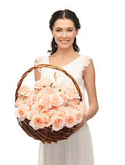 Image showing woman with basket full of flowers