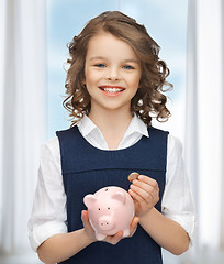 Image showing girl with piggy bank