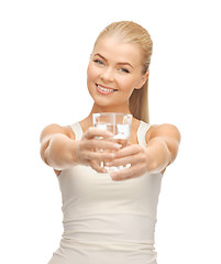 Image showing young smiling woman with glass of water