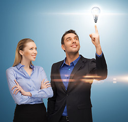 Image showing man and woman with light bulb