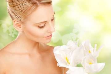 Image showing lovely woman with lily flower and butterflies