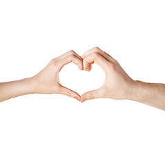 Image showing woman and man hands showing heart shape