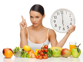 Image showing woman with big clock