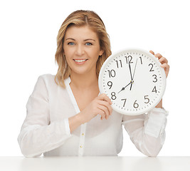 Image showing woman with clock