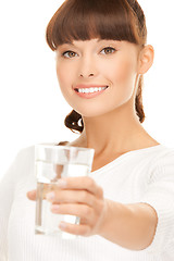 Image showing young smiling woman with glass of water