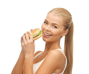 Image showing woman eating junk food