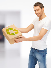 Image showing handsome man with recyclable box