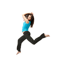 Image showing sporty woman jumping in sportswear