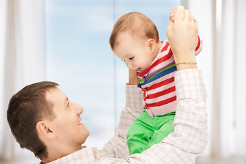 Image showing happy father with adorable baby