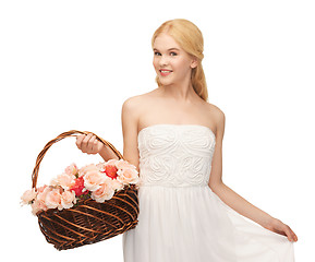 Image showing woman with basket full of flowers