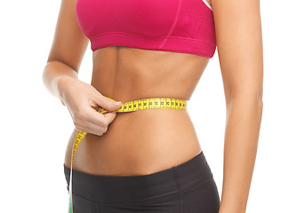 Image showing trained belly with measuring tape