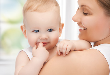 Image showing happy mother with adorable baby