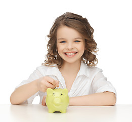 Image showing girl with piggy bank