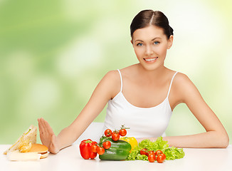 Image showing woman with hamburger and vegetables