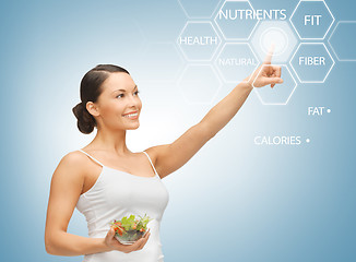 Image showing woman with salad and virtual screen