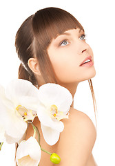 Image showing lovely woman with orchid flower