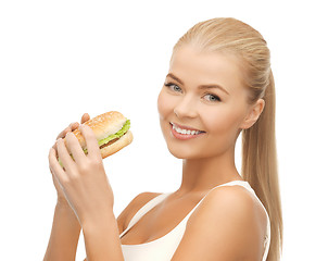 Image showing woman eating junk food