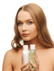 Image showing woman with cosmetic bottles