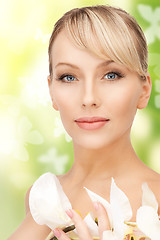 Image showing beautiful woman with orchid flower and butterflies