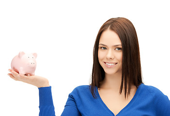 Image showing lovely woman with small piggy bank