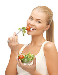 Image showing healthy woman holding bowl with salad