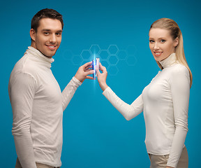 Image showing man and woman with modern gadgets