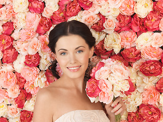 Image showing woman with background full of roses