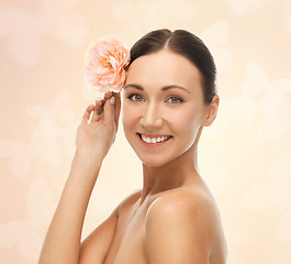 Image showing smiling woman with flowers