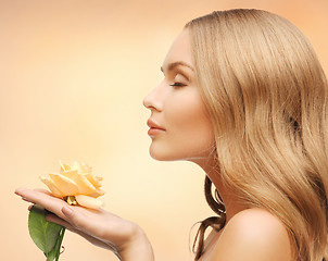 Image showing lovely woman with rose flower