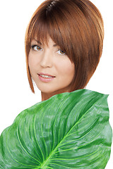 Image showing woman with green leaf