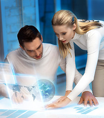 Image showing man and woman working with virtual screen