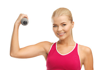 Image showing young sporty woman with light dumbbell