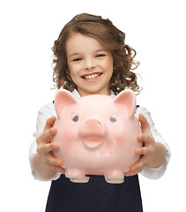 Image showing girl with piggy bank