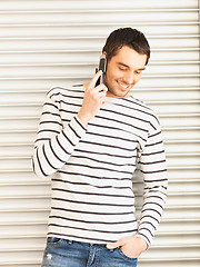 Image showing man in casual clothes talking on the phone