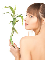 Image showing woman with green sprout