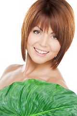 Image showing woman with green leaf