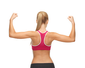 Image showing sporty woman showing her biceps