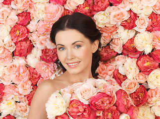 Image showing woman with background full of roses