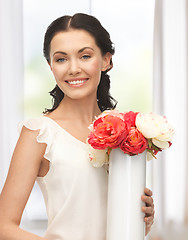 Image showing woman with vase of flowers