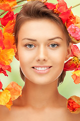 Image showing lovely woman with red flowers