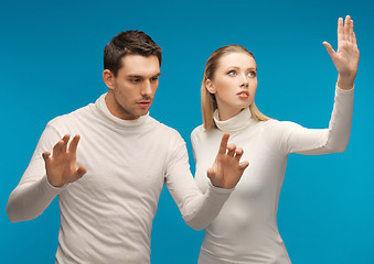 Image showing man and woman working with something imaginary