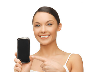 Image showing woman pointing at smartphone with sport app