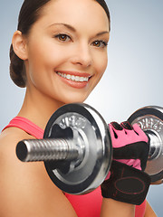 Image showing woman with dumbbells