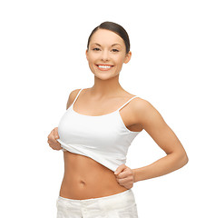 Image showing woman taking off  blank white t-shirt