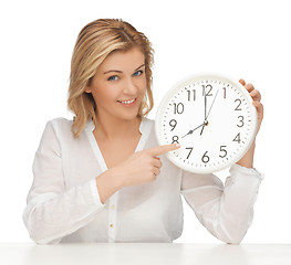 Image showing woman with clock