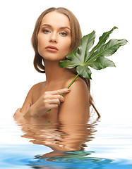 Image showing woman with green leaf