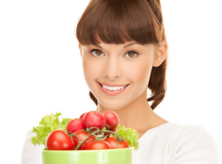 Image showing woman in the kitchen with tomatoes