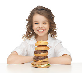 Image showing little girl with junk food