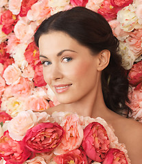 Image showing woman with background full of roses